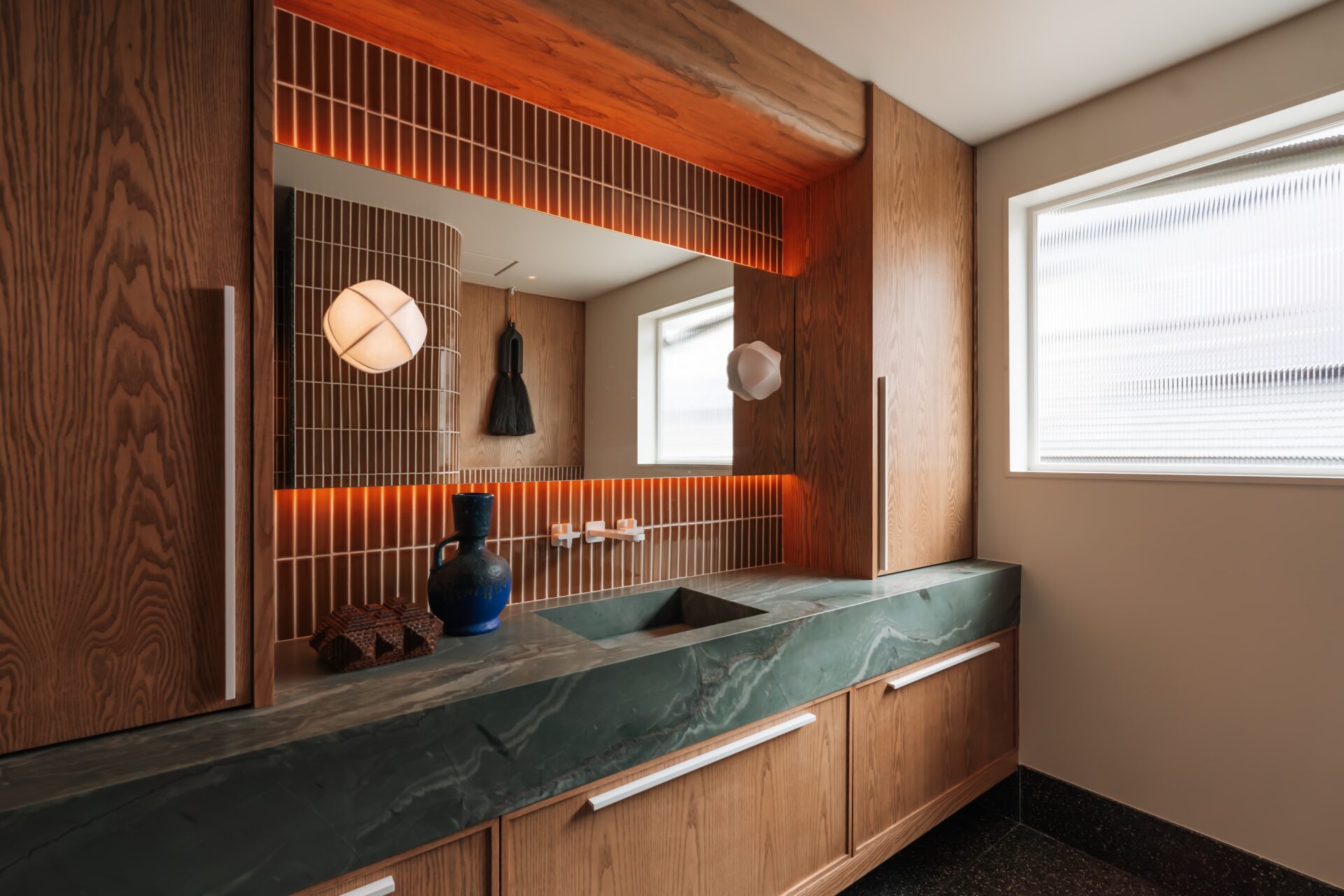 The Station hall bathroom, curved shower and stone detail